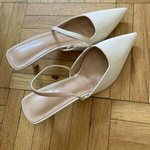 Nude plump heels pull back